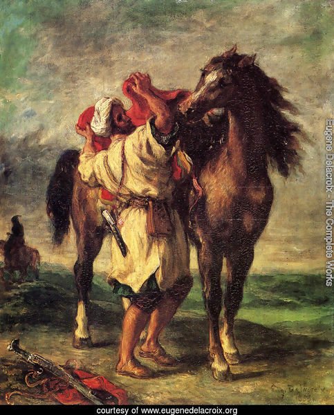 A Moroccan Saddling A Horse